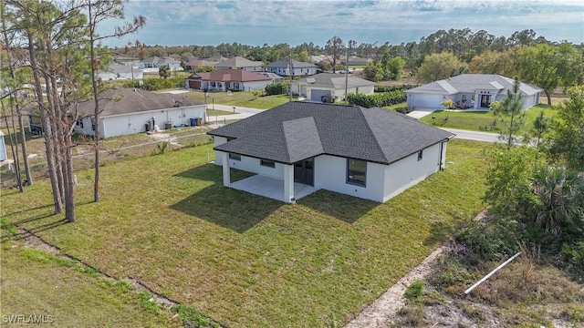 birds eye view of property with a residential view