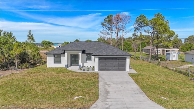 view of front of house with a garage, fence, driveway, roof with shingles, and a front yard