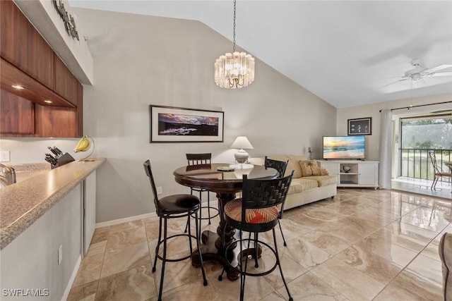 dining room with high vaulted ceiling, baseboards, marble finish floor, and ceiling fan with notable chandelier