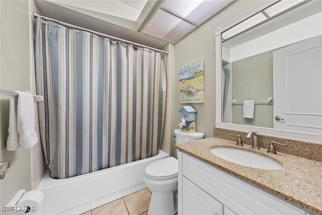 bathroom featuring tile patterned flooring, vanity, toilet, and shower / bath combo