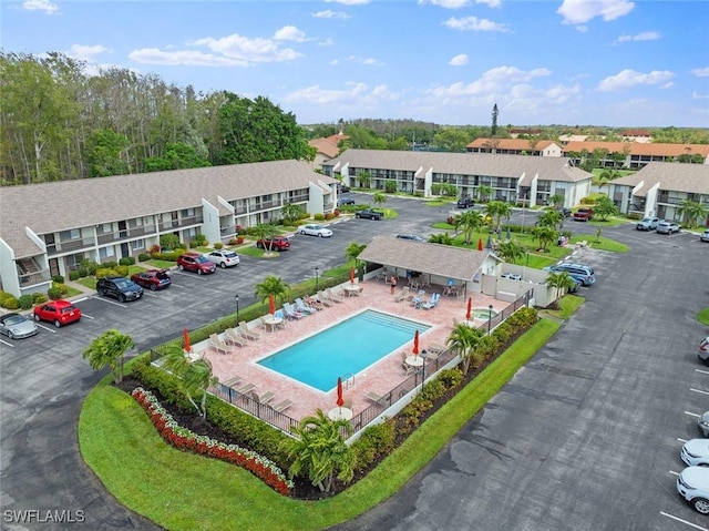 birds eye view of property with a residential view