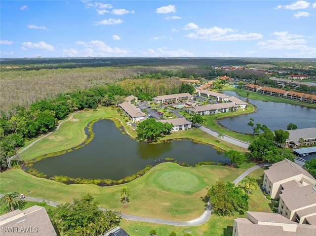 birds eye view of property with view of golf course and a water view