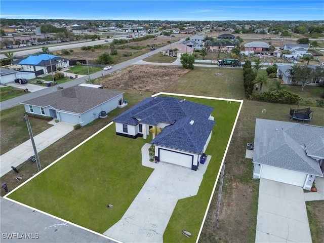 birds eye view of property with a residential view