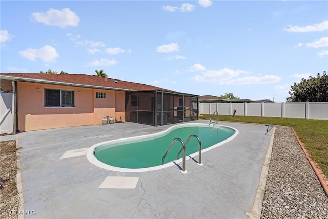 view of swimming pool with a patio, a fenced backyard, and a sunroom