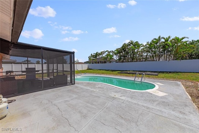 view of swimming pool with a fenced backyard, a fenced in pool, and a patio