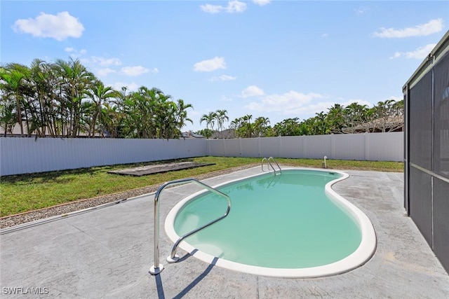 view of pool with a yard, a patio area, a fenced in pool, and a fenced backyard