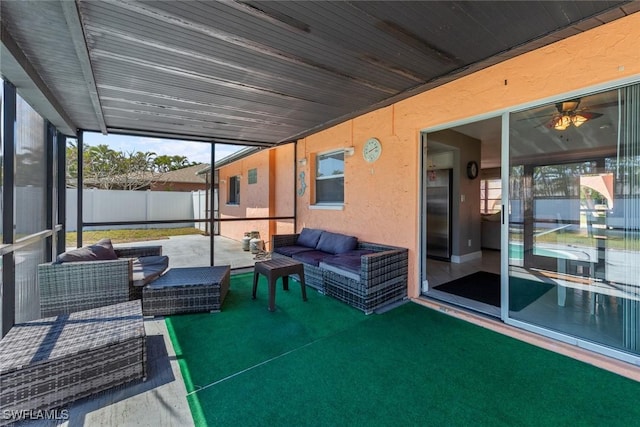 view of patio / terrace with an outdoor living space and fence