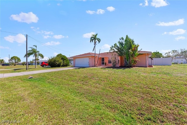 ranch-style home featuring stucco siding, driveway, a front lawn, and a garage