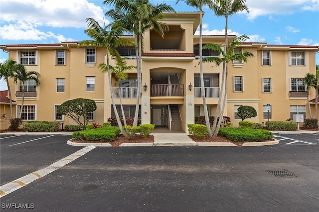 view of property with uncovered parking