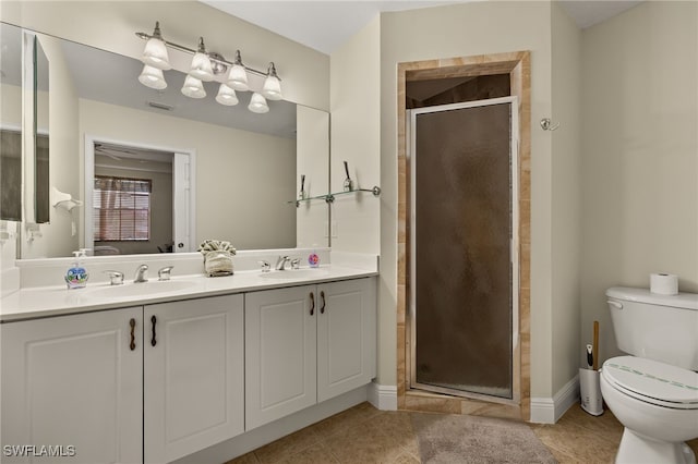 bathroom with toilet, tile patterned flooring, and a sink