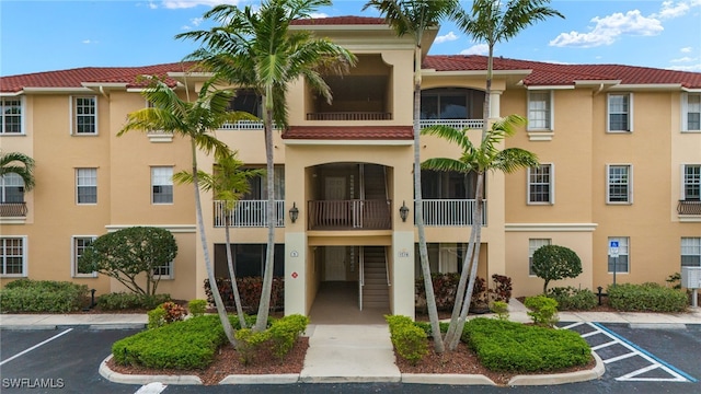 view of property with uncovered parking