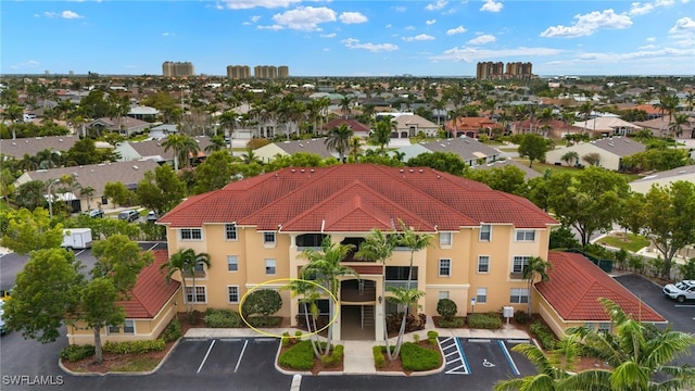 birds eye view of property with a residential view