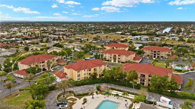 birds eye view of property with a residential view