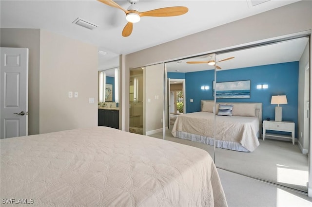 bedroom featuring baseboards, visible vents, a ceiling fan, carpet flooring, and a closet