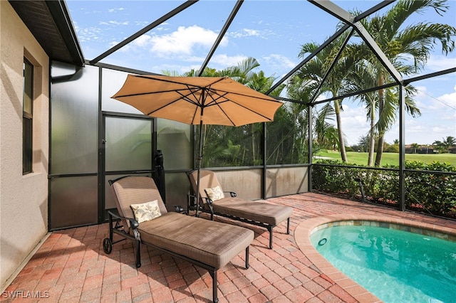 pool featuring a lanai and a patio