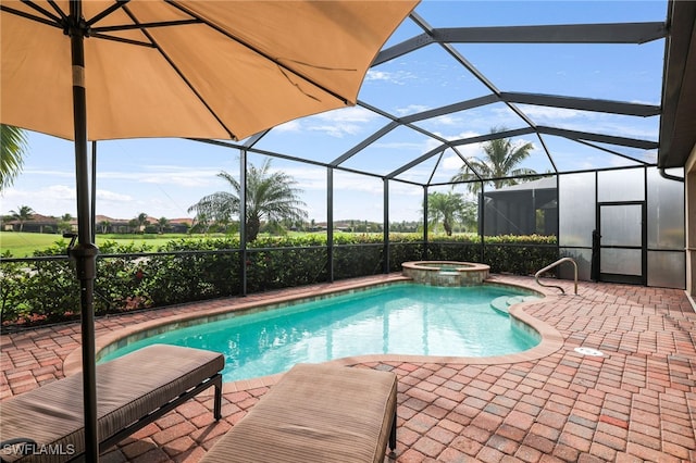 view of pool with a patio, a lanai, and a pool with connected hot tub