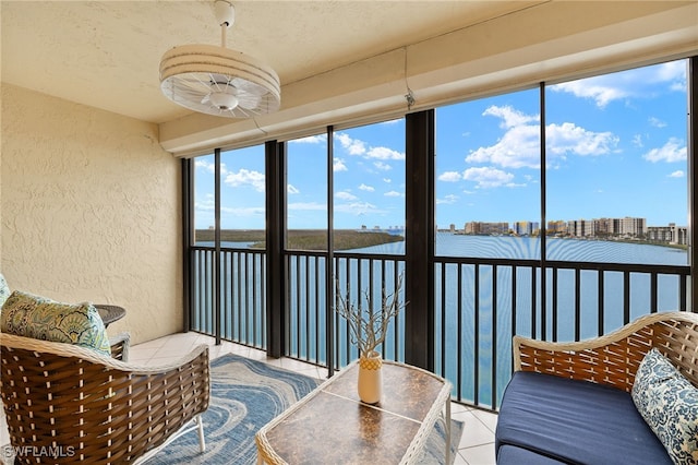 sunroom / solarium with a water view