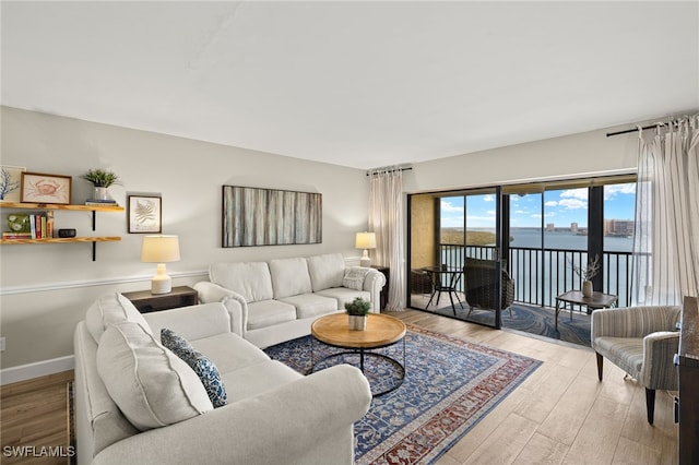 living area featuring wood finished floors and baseboards