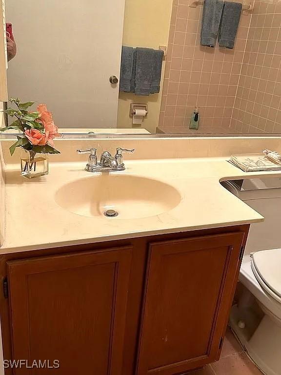 bathroom with vanity and toilet