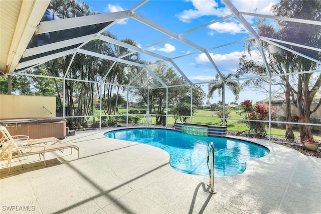 pool with a lanai, an outdoor hot tub, and a patio