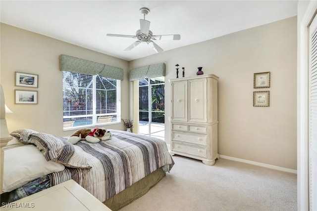 bedroom with a ceiling fan, access to outside, light carpet, and baseboards