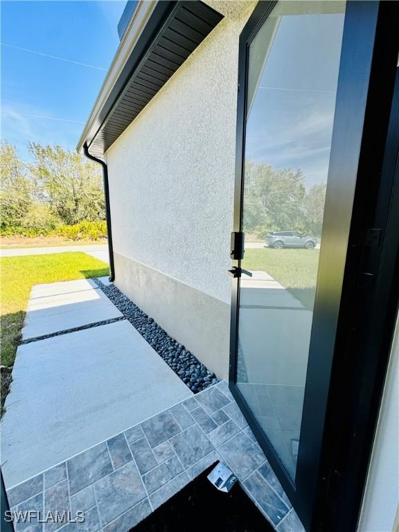 entry to storm shelter with a patio