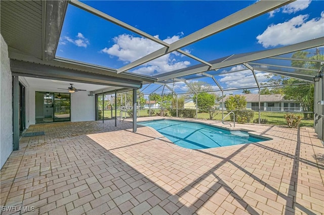 outdoor pool featuring a lanai and a patio