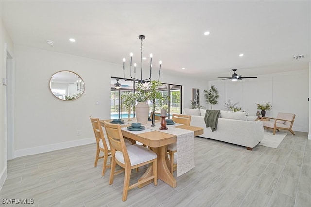 dining space with ceiling fan with notable chandelier, light wood-style floors, visible vents, and recessed lighting