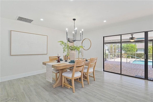 dining room with a chandelier, recessed lighting, visible vents, and baseboards