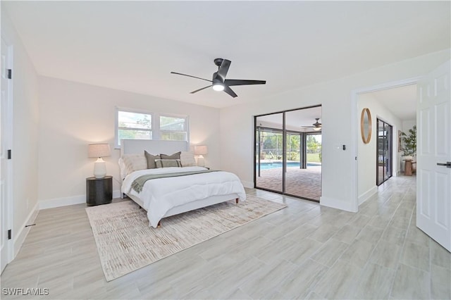 bedroom with access to exterior, multiple windows, baseboards, and a ceiling fan