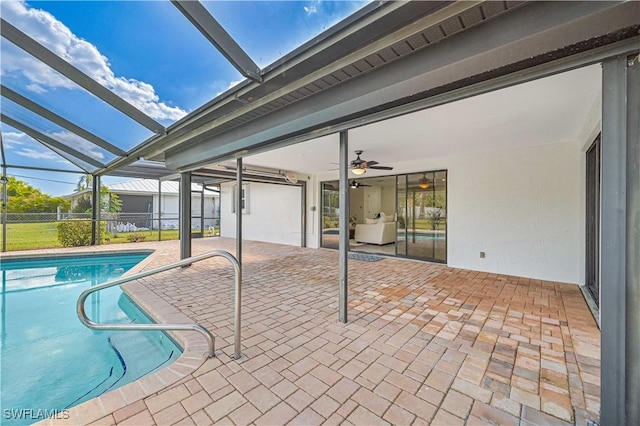 outdoor pool with a patio and a lanai