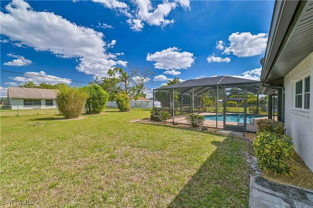 view of yard featuring glass enclosure, an outdoor pool, and fence