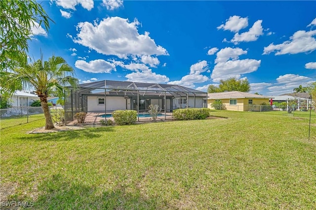 back of house with fence private yard, an outdoor pool, glass enclosure, and a lawn