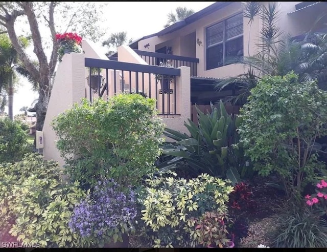 view of side of property featuring stucco siding