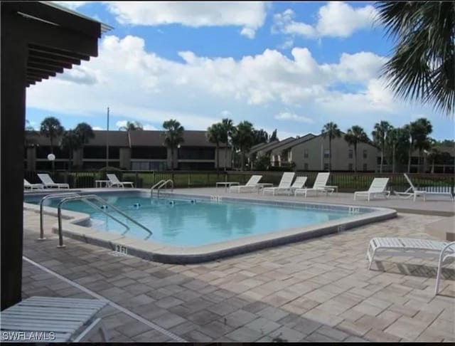 pool featuring a patio and fence