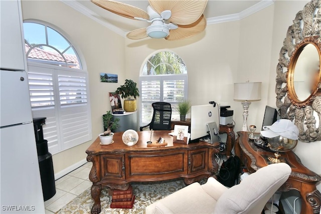 tiled office featuring ceiling fan, ornamental molding, and a healthy amount of sunlight