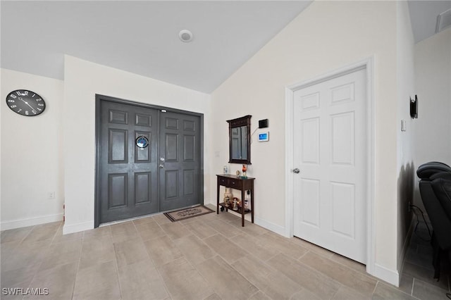 foyer entrance featuring baseboards