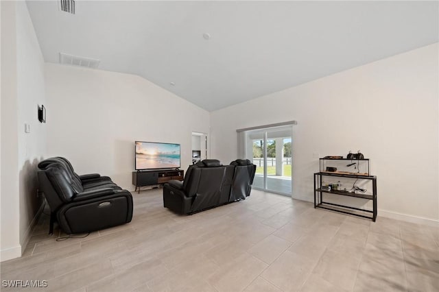 living room with visible vents, vaulted ceiling, and baseboards