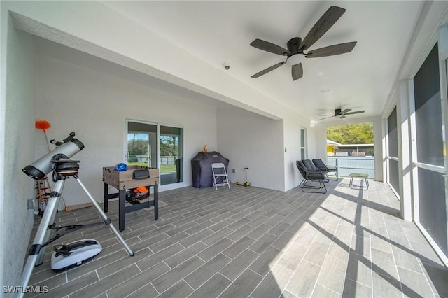 view of patio featuring a ceiling fan