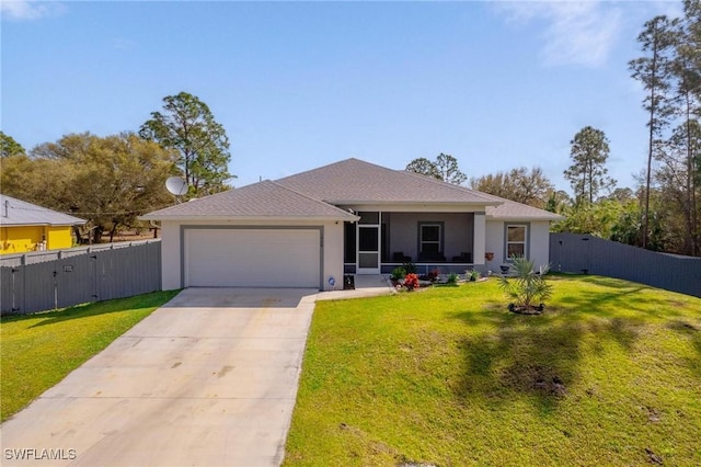 ranch-style home with driveway, a front lawn, an attached garage, and fence