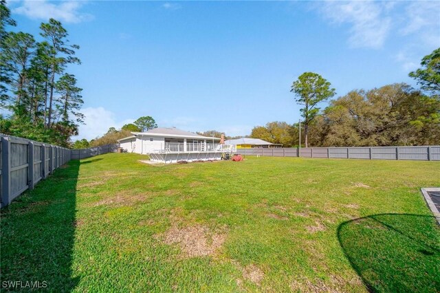 view of yard with a fenced backyard