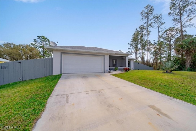 ranch-style house with driveway, an attached garage, fence, a front yard, and stucco siding