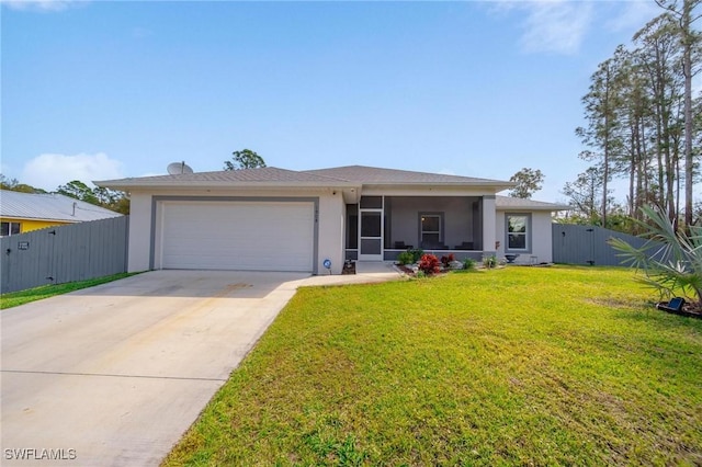 view of front of house featuring a front lawn, an attached garage, fence, and stucco siding