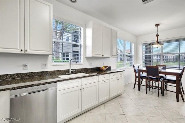 kitchen featuring dishwasher, hanging light fixtures, white cabinetry, a sink, and light tile patterned flooring