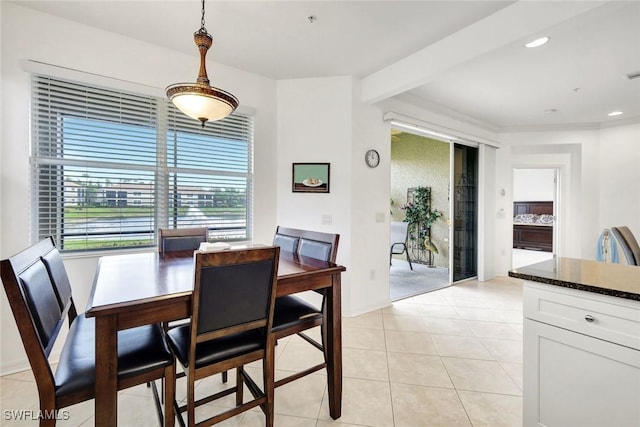 dining area featuring light tile patterned floors, beam ceiling, and recessed lighting