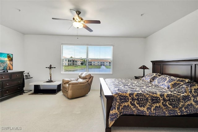 bedroom featuring ceiling fan and light colored carpet