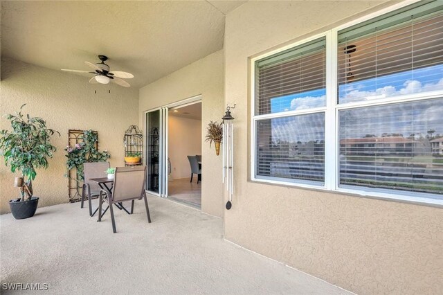 exterior space with ceiling fan