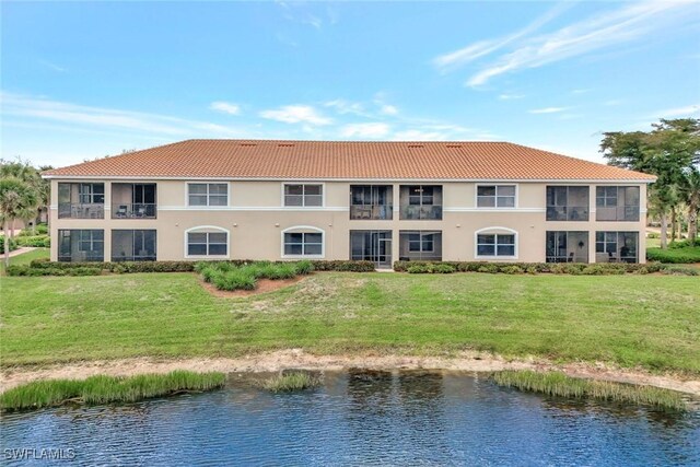 view of building exterior featuring a water view