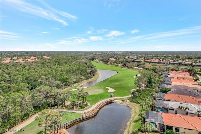 birds eye view of property featuring a water view and golf course view