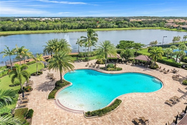 community pool with a water view, a patio area, and a gazebo